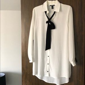 Long flowing white dress shirt.